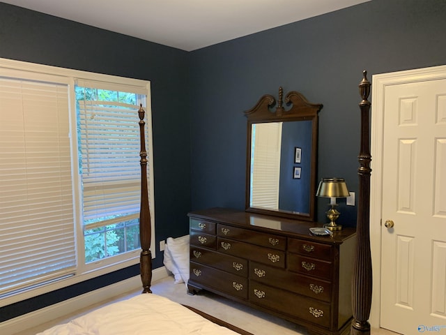 bedroom with carpet floors and baseboards