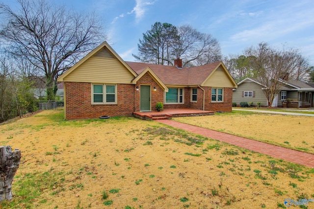 single story home with a patio, brick siding, a chimney, and a front yard