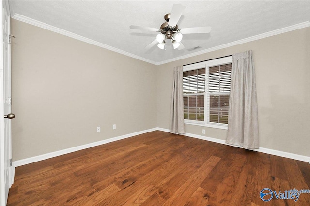 spare room with wood finished floors, baseboards, ceiling fan, and crown molding