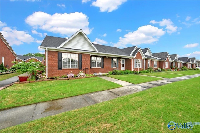 view of front of home featuring a front lawn, brick siding, and a residential view