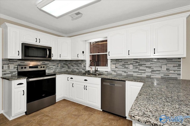 kitchen with stainless steel appliances, a sink, dark stone countertops, backsplash, and ornamental molding