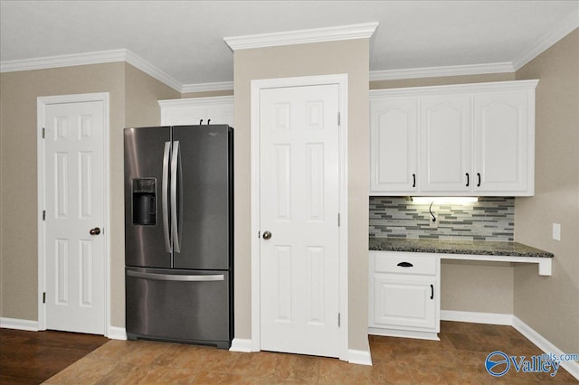 kitchen with ornamental molding, stainless steel fridge with ice dispenser, white cabinetry, and tasteful backsplash