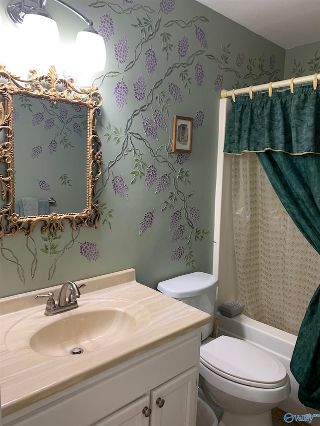 full bathroom with vanity, shower / bath combo, and toilet