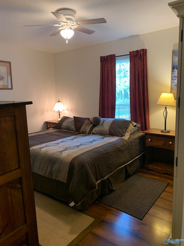 bedroom featuring wood-type flooring and ceiling fan