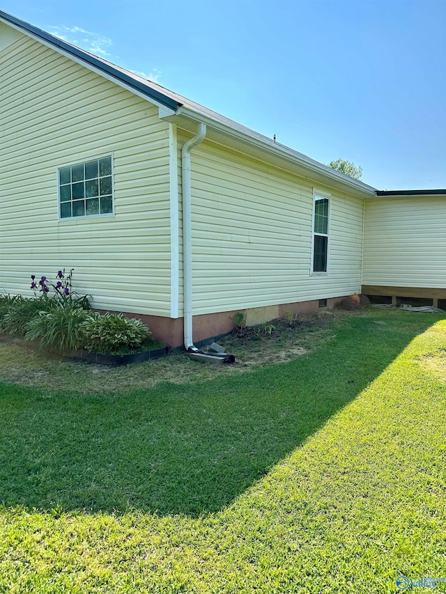 view of property exterior featuring a yard