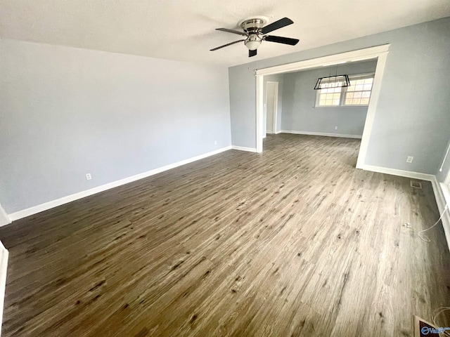 empty room featuring wood-type flooring and ceiling fan