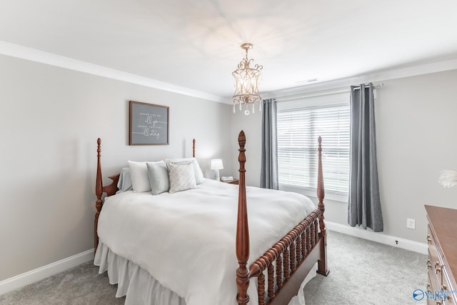 carpeted bedroom featuring an inviting chandelier and crown molding