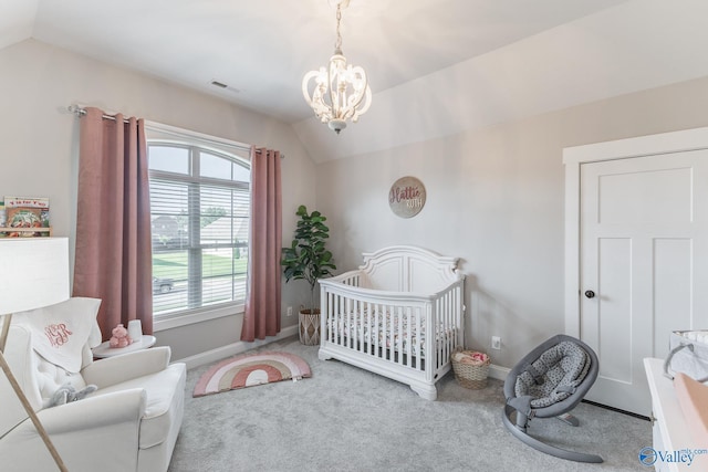 bedroom featuring lofted ceiling, carpet floors, baseboards, a nursery area, and an inviting chandelier