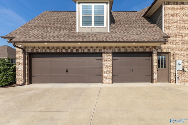 garage with concrete driveway