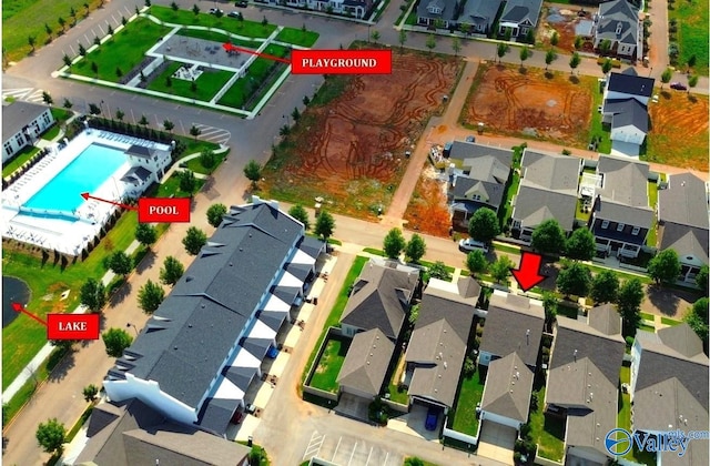 birds eye view of property with a residential view