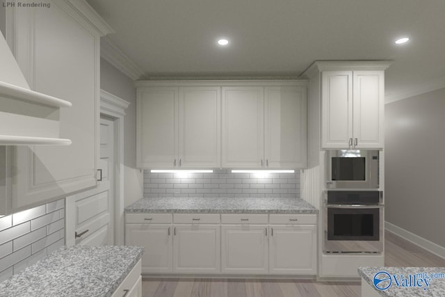 kitchen featuring light hardwood / wood-style floors, white cabinetry, ornamental molding, backsplash, and stainless steel appliances