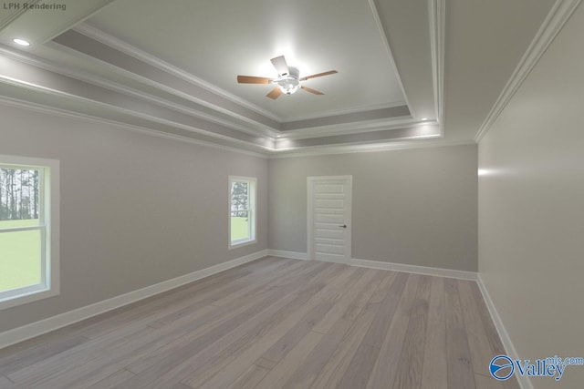 unfurnished room featuring ornamental molding, light wood-type flooring, ceiling fan, and a raised ceiling