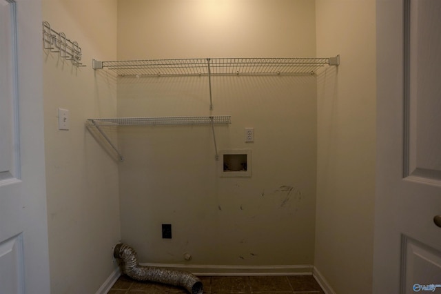 laundry area with electric dryer hookup, hookup for a washing machine, laundry area, and baseboards