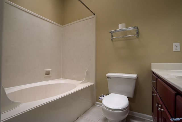 full bathroom featuring tile patterned floors, toilet, baseboards, vanity, and a tub