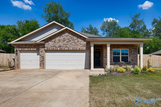 view of front of home featuring a front yard and a garage