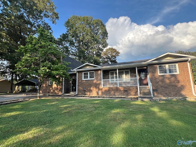 ranch-style house with brick siding, a detached carport, covered porch, crawl space, and a front lawn