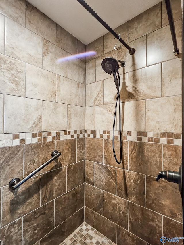 full bathroom with a tile shower