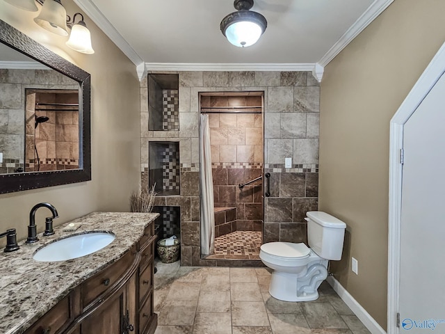 bathroom featuring baseboards, toilet, crown molding, vanity, and a shower stall