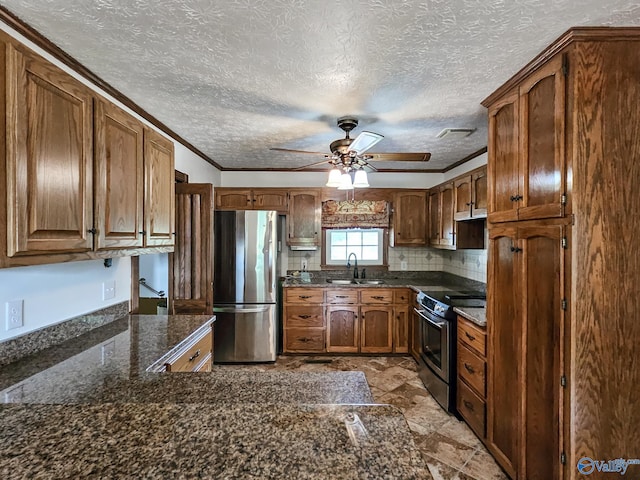 kitchen featuring brown cabinets, crown molding, backsplash, appliances with stainless steel finishes, and a sink