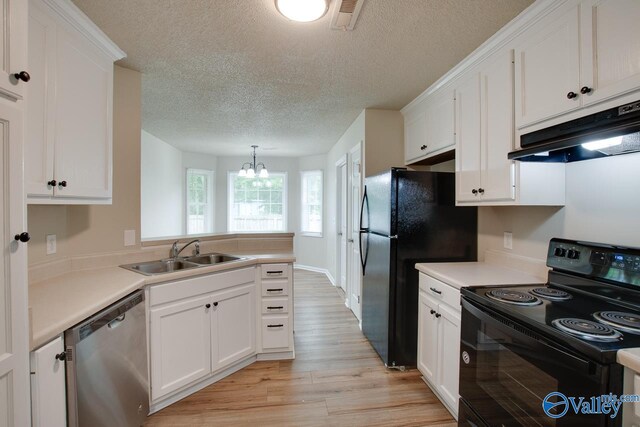 kitchen with black appliances, a sink, under cabinet range hood, a chandelier, and light wood-type flooring