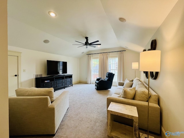 living room with ceiling fan, carpet flooring, and lofted ceiling