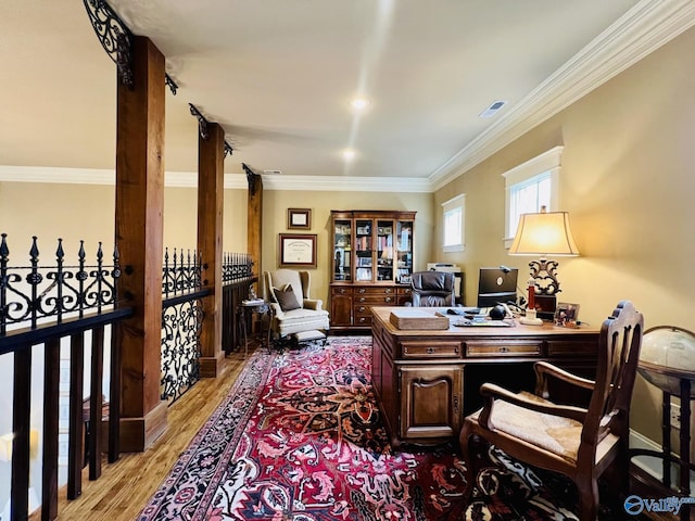 office featuring ornamental molding and light hardwood / wood-style floors