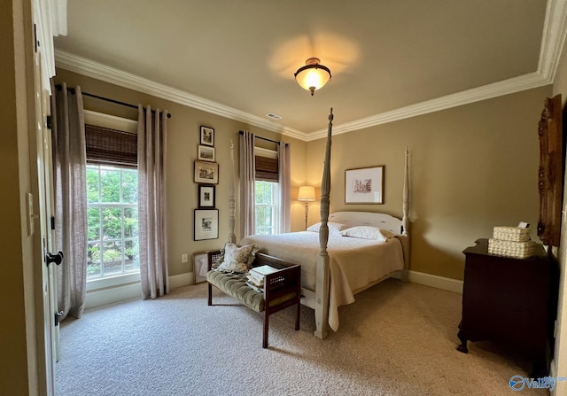 bedroom with light colored carpet and crown molding