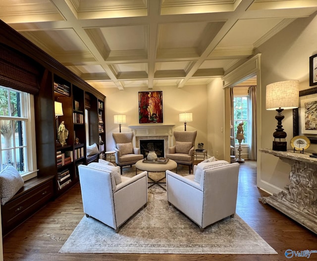 living room with beam ceiling, hardwood / wood-style flooring, and coffered ceiling