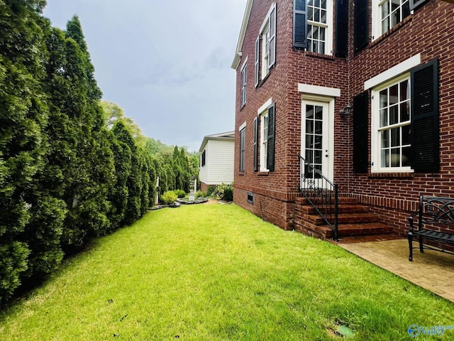 view of home's exterior featuring a lawn