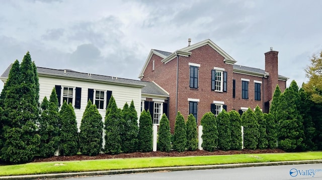 view of home's exterior with a lawn