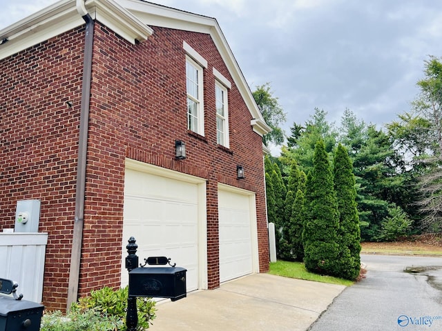 view of side of property featuring a garage