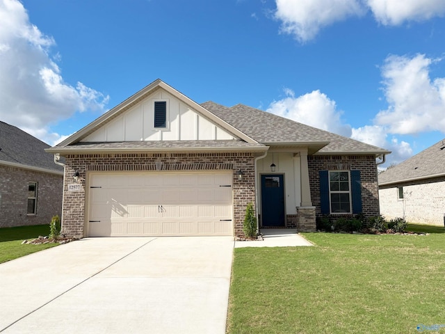 view of front of property with a garage and a front yard