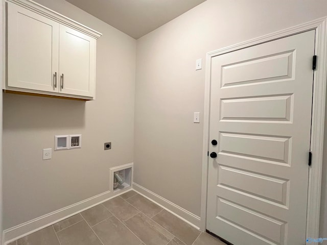 clothes washing area featuring cabinets, hookup for an electric dryer, and hookup for a washing machine