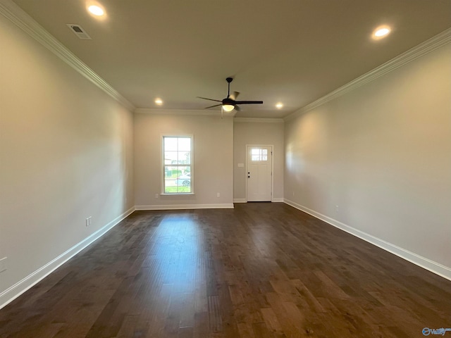 empty room with ornamental molding, dark hardwood / wood-style floors, and ceiling fan