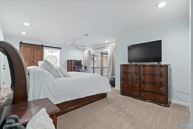 bedroom with access to exterior, light carpet, ornamental molding, ceiling fan, and a barn door