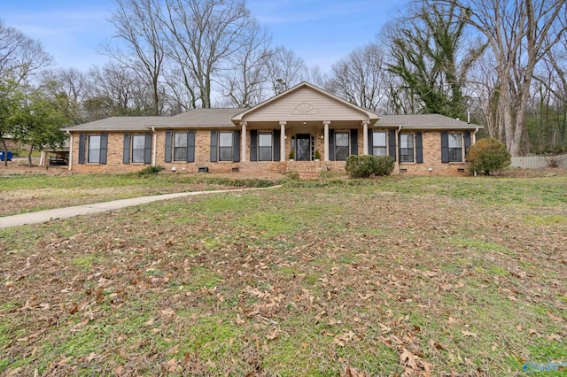 single story home with a front lawn