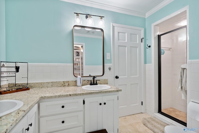 bathroom with tile patterned floors, vanity, crown molding, and walk in shower