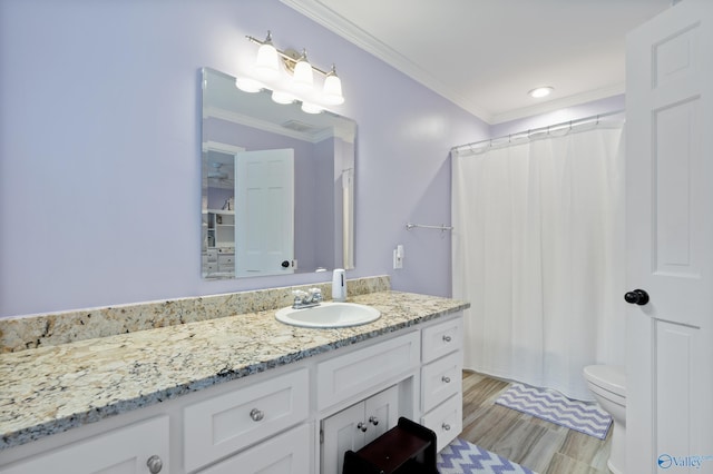 bathroom featuring hardwood / wood-style floors, vanity, crown molding, toilet, and curtained shower