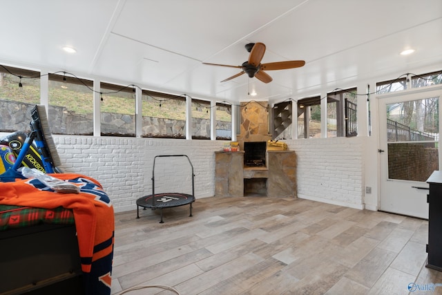 sunroom / solarium with ceiling fan