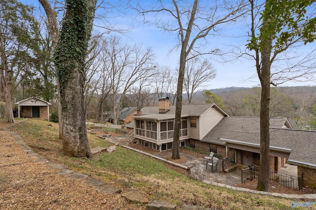 view of yard featuring a sunroom