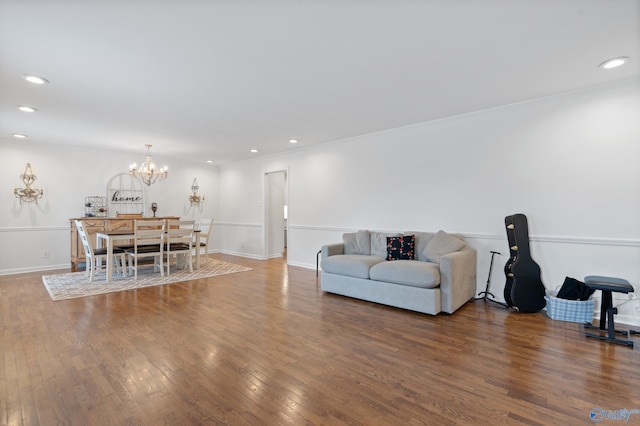 living room featuring hardwood / wood-style floors and a notable chandelier