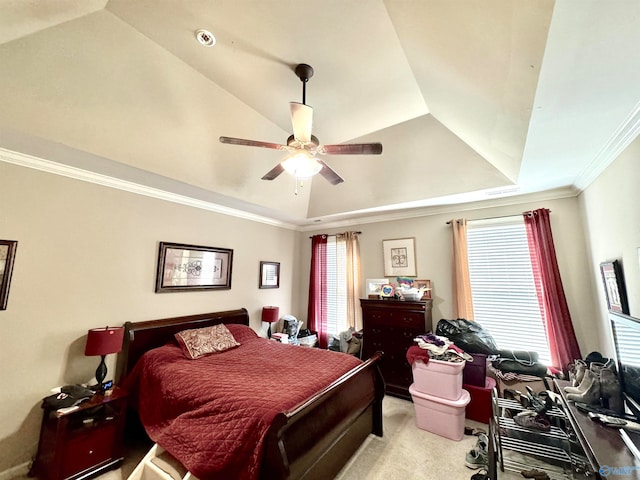 carpeted bedroom featuring a raised ceiling, multiple windows, ornamental molding, and ceiling fan