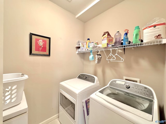 laundry area with independent washer and dryer