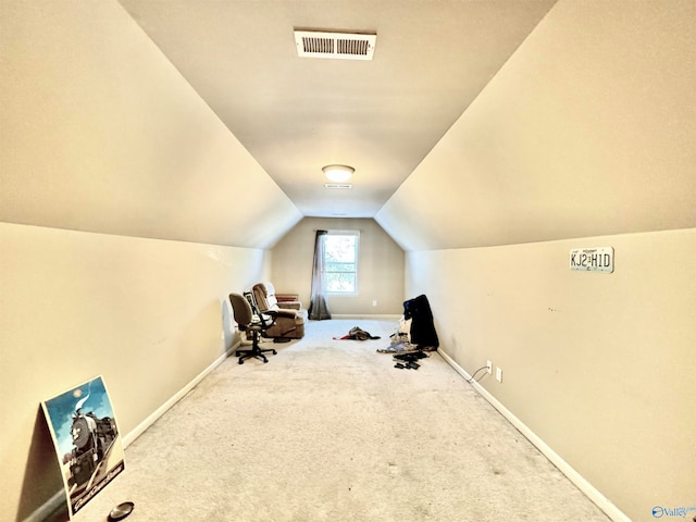 workout area with carpet flooring and lofted ceiling