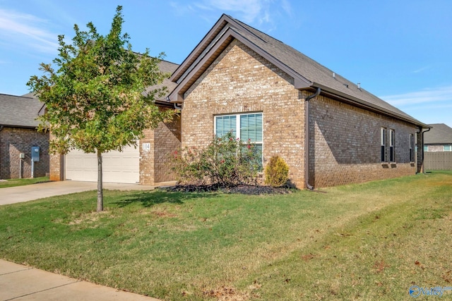 view of front of property with a garage and a front lawn