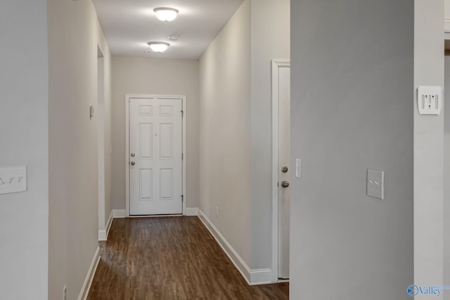 hallway with dark wood-type flooring