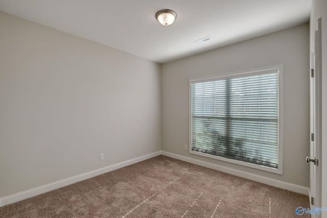 view of carpeted spare room