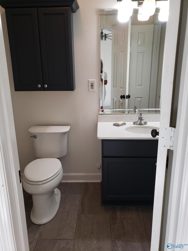 full bathroom with vanity,  shower combination, and toilet