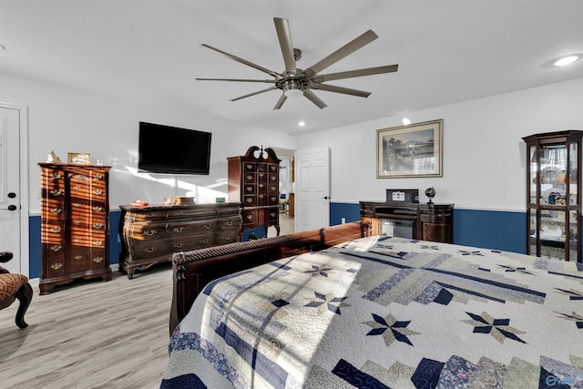 bedroom featuring a ceiling fan, recessed lighting, and wood finished floors