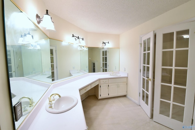 bathroom featuring vanity and a textured ceiling